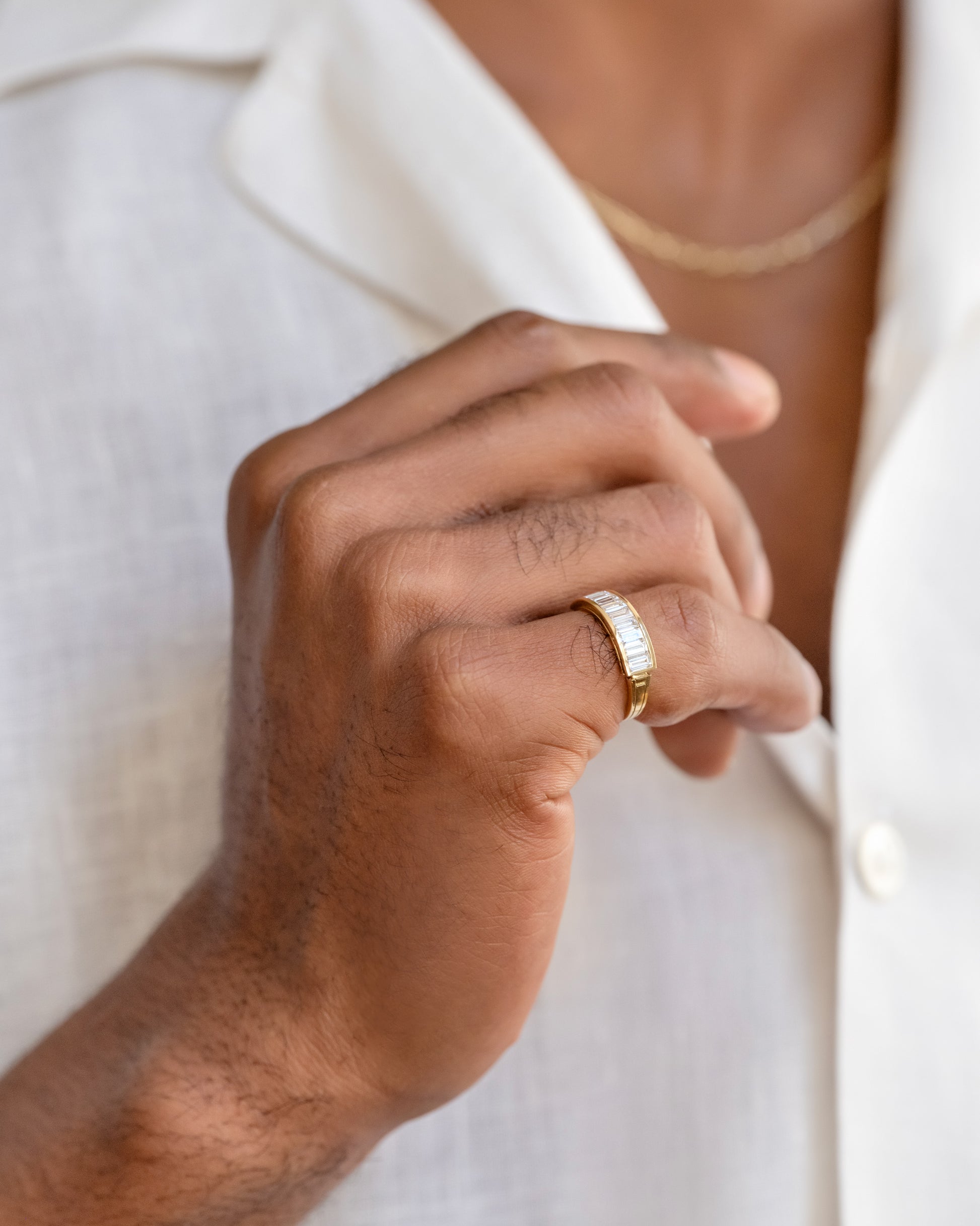 Gold Arcade Rings on male model.