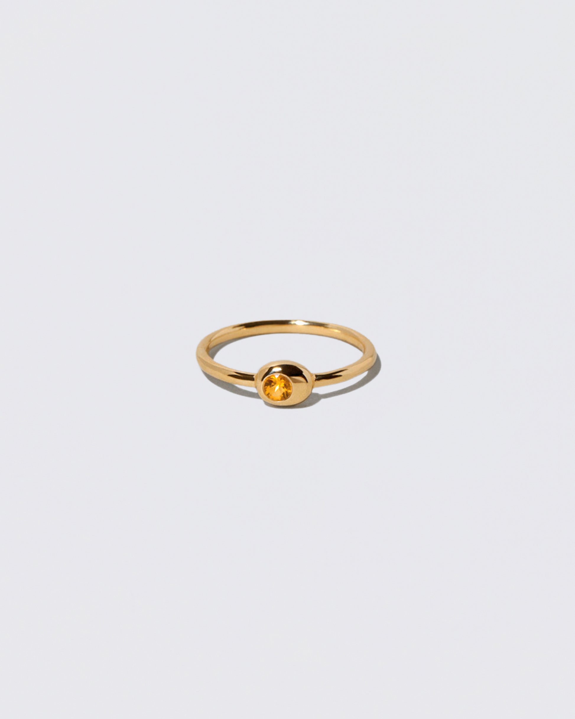 Citrine Birthstone Level Ring on light color background.