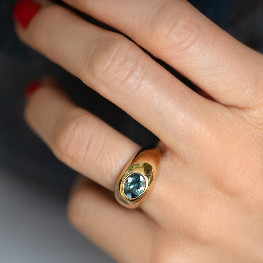 product_details::Teal Sapphire Jupiter Ring on model.