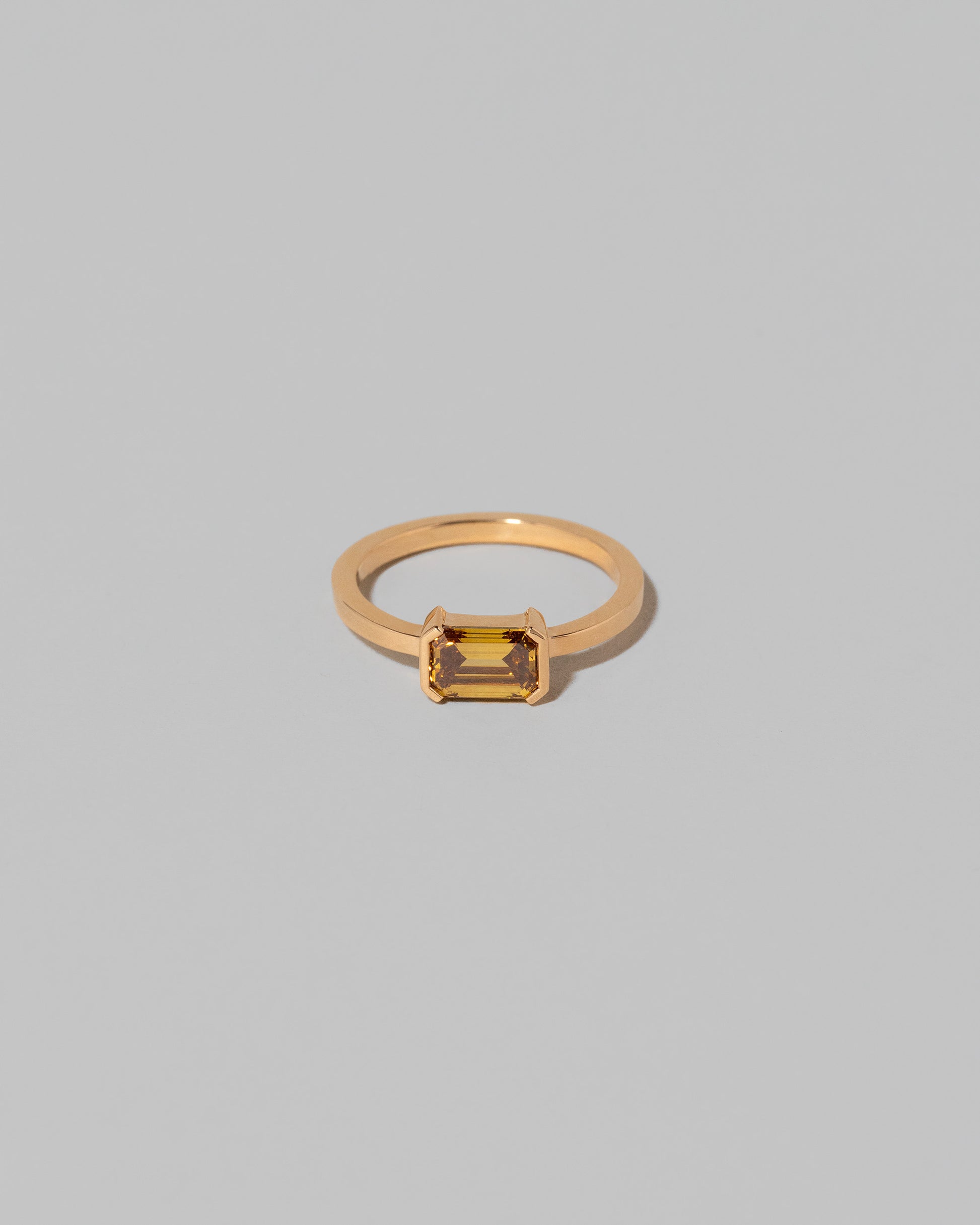 Brown Diamond Courtship Ring on light color background.