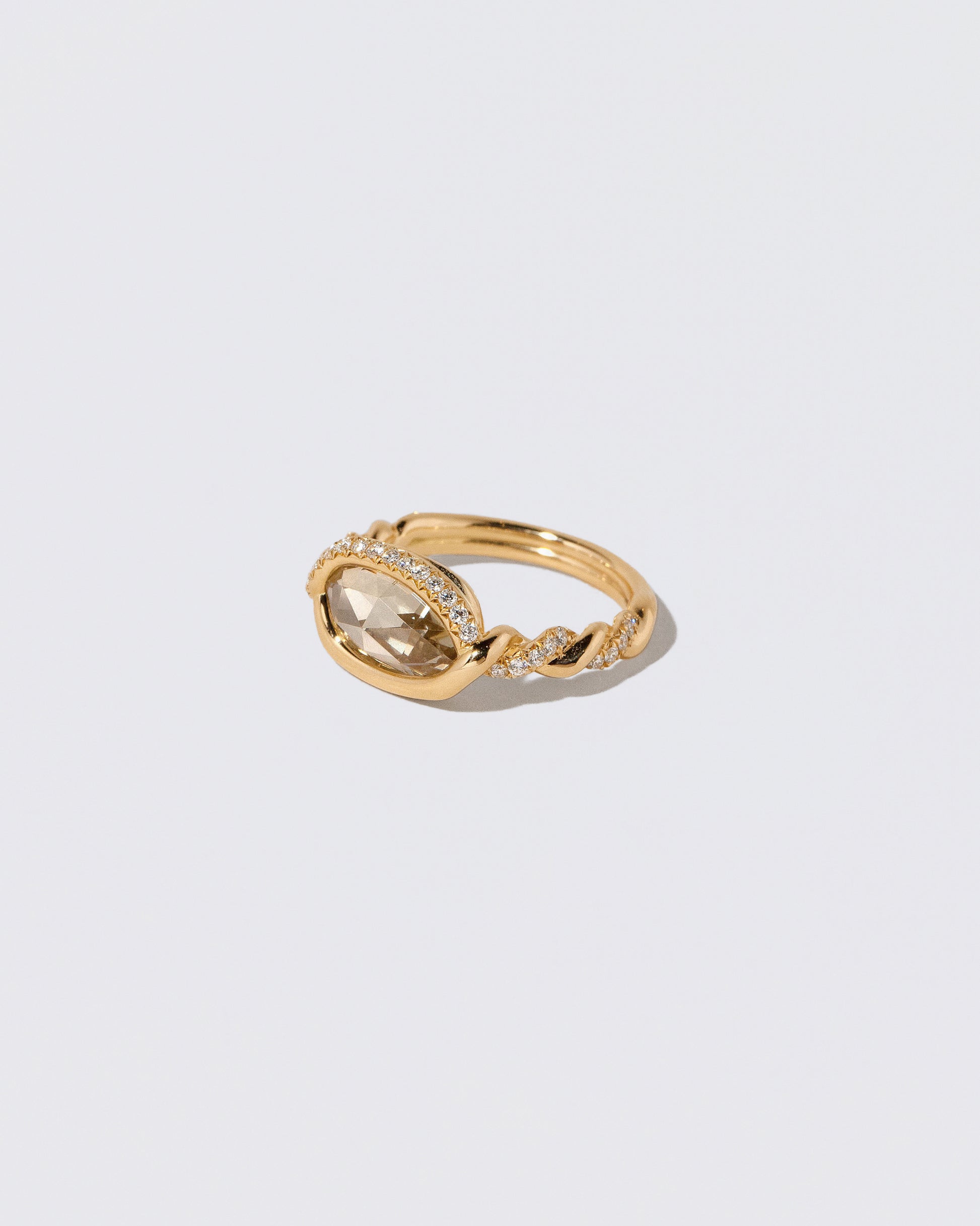 View from the side of the Encircle Ring on light color background.