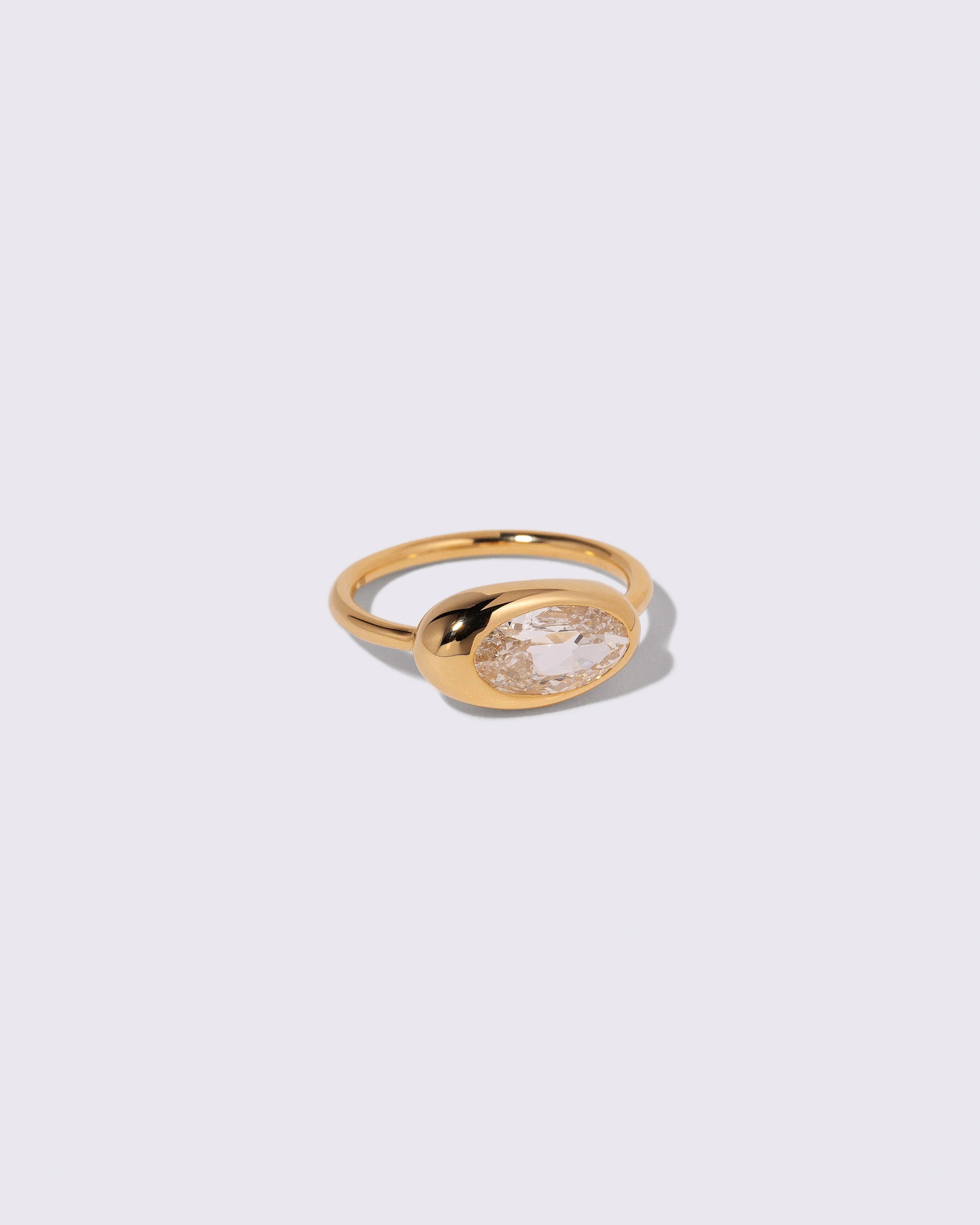 View from the side of the Moval Diamond Equalize Ring on light color background.