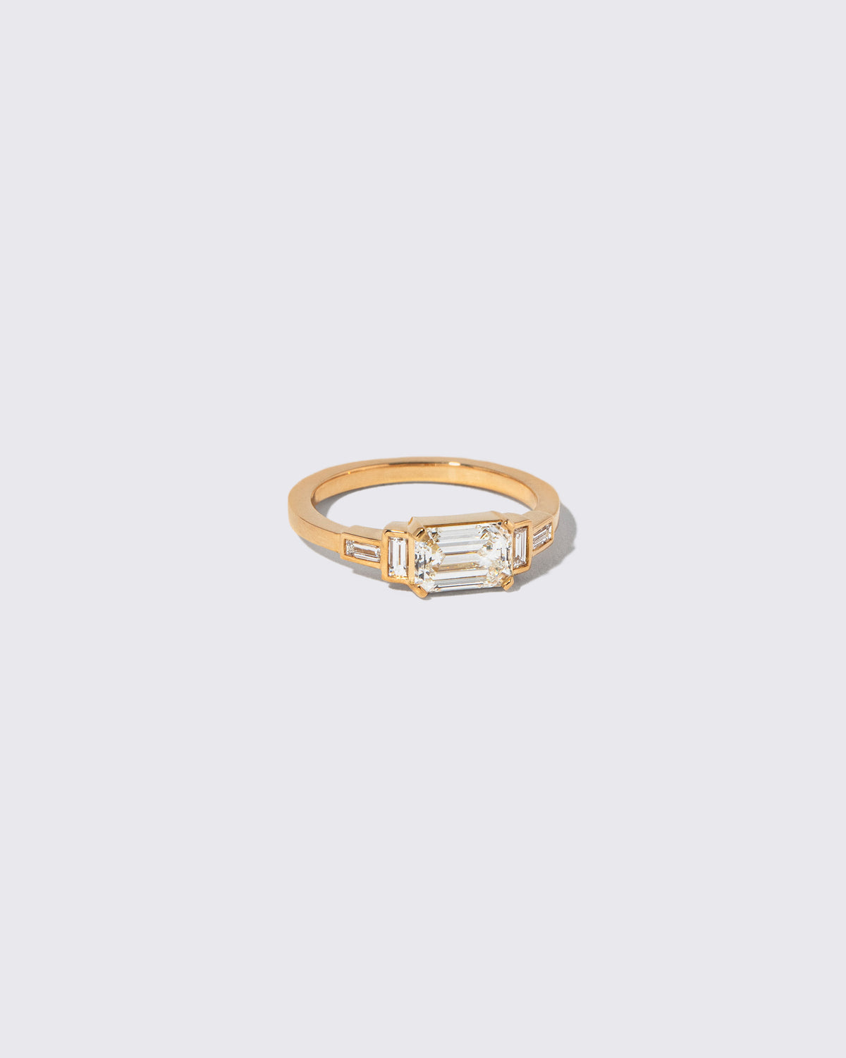 View from the side of the Diamond Expression Ring on light color background.