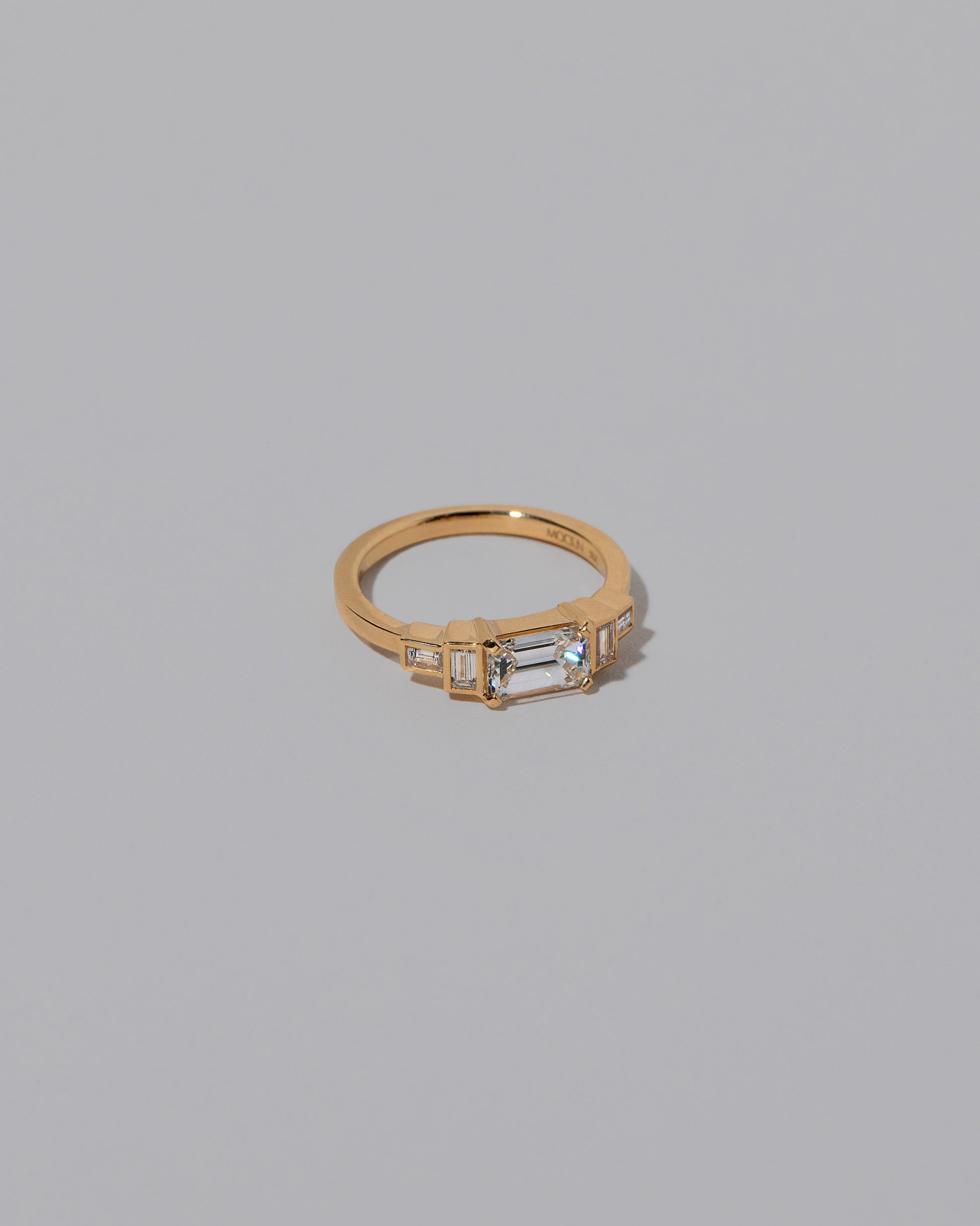 View from the side of the Diamond Expression Ring on light color background.