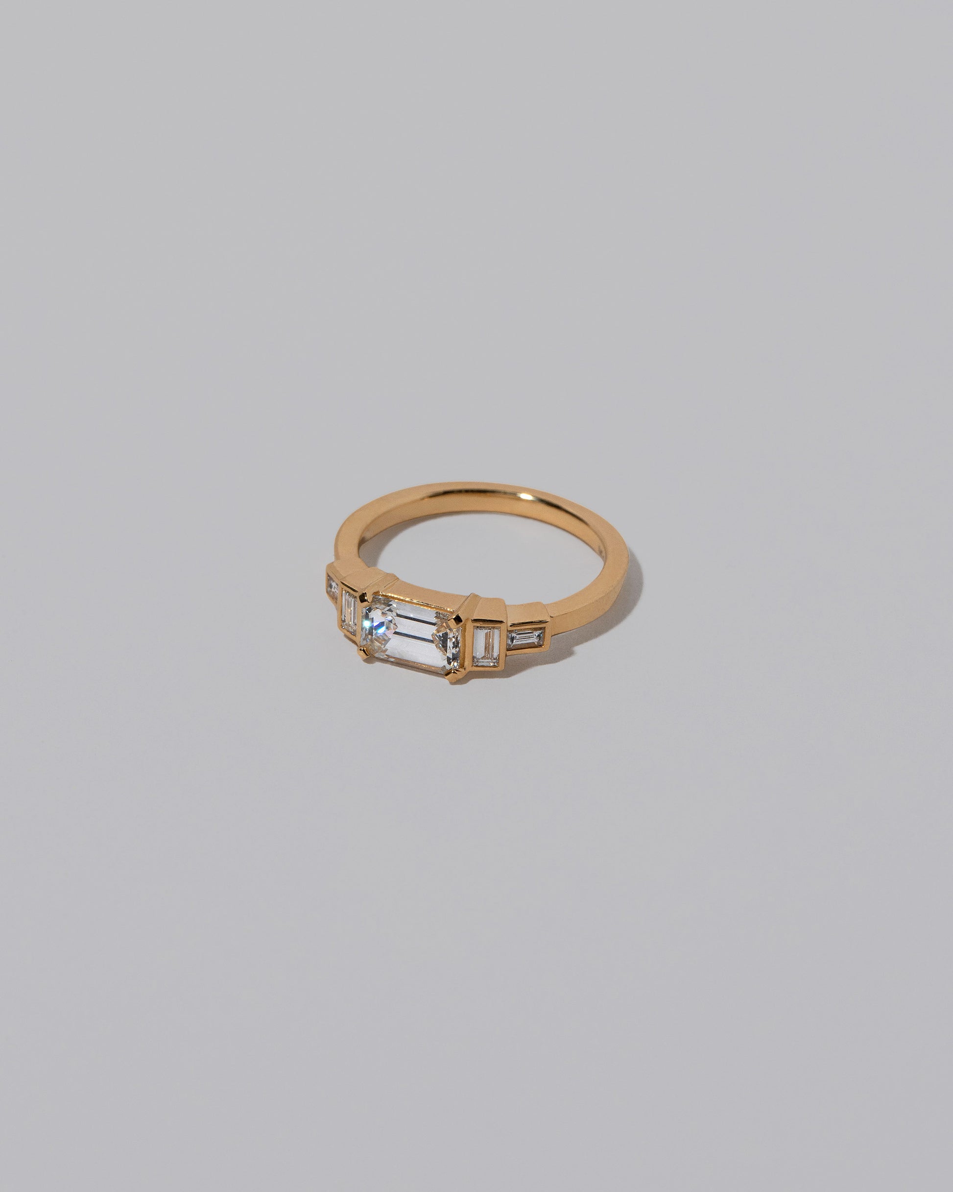 View from the side of the Diamond Expression Ring on light color background.