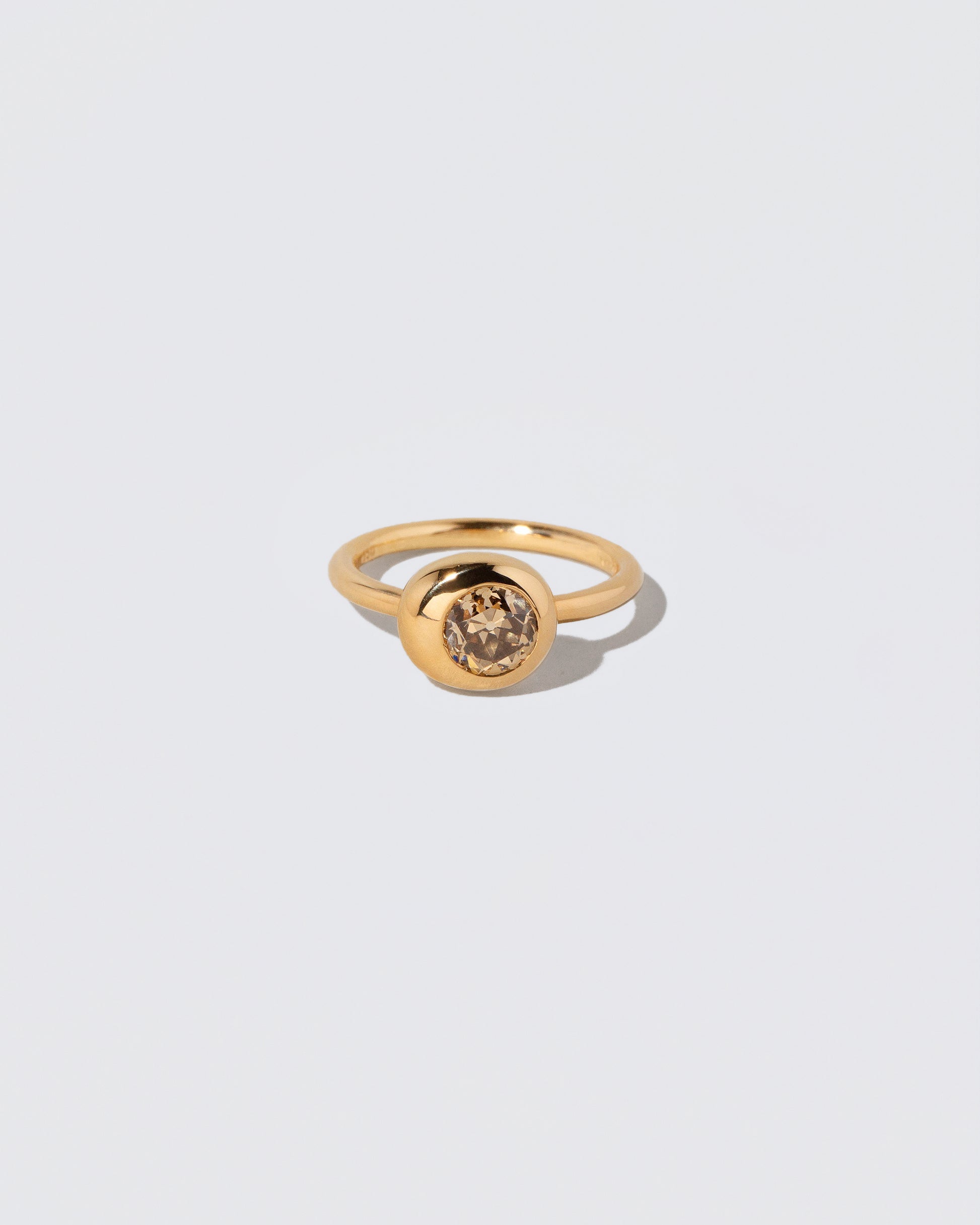 Champagne Diamond Grand Level Ring on light color background.