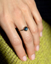 Gusher Blue Sapphire Ring 005 on model.