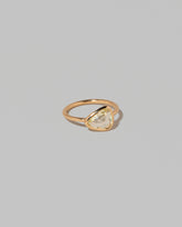 View from the side of the Gusher Chartreuse Sapphire Ring 003 on light color background.