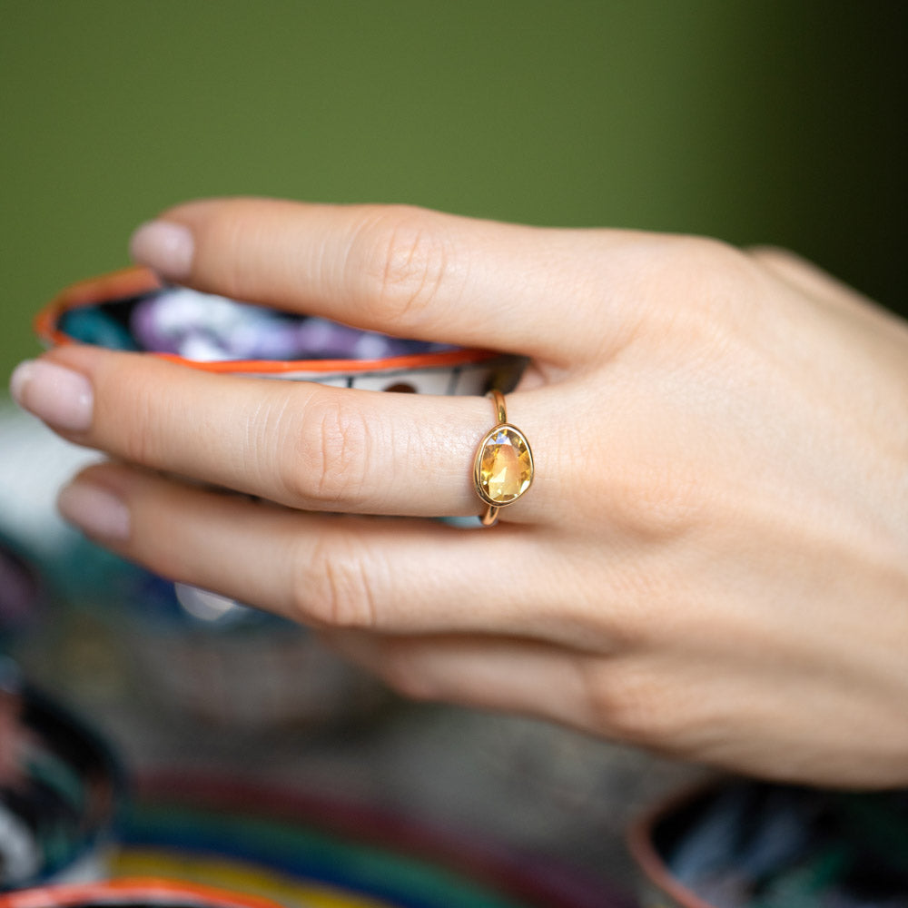 product_details::Gusher Yellow Sapphire Ring 033 on model.
