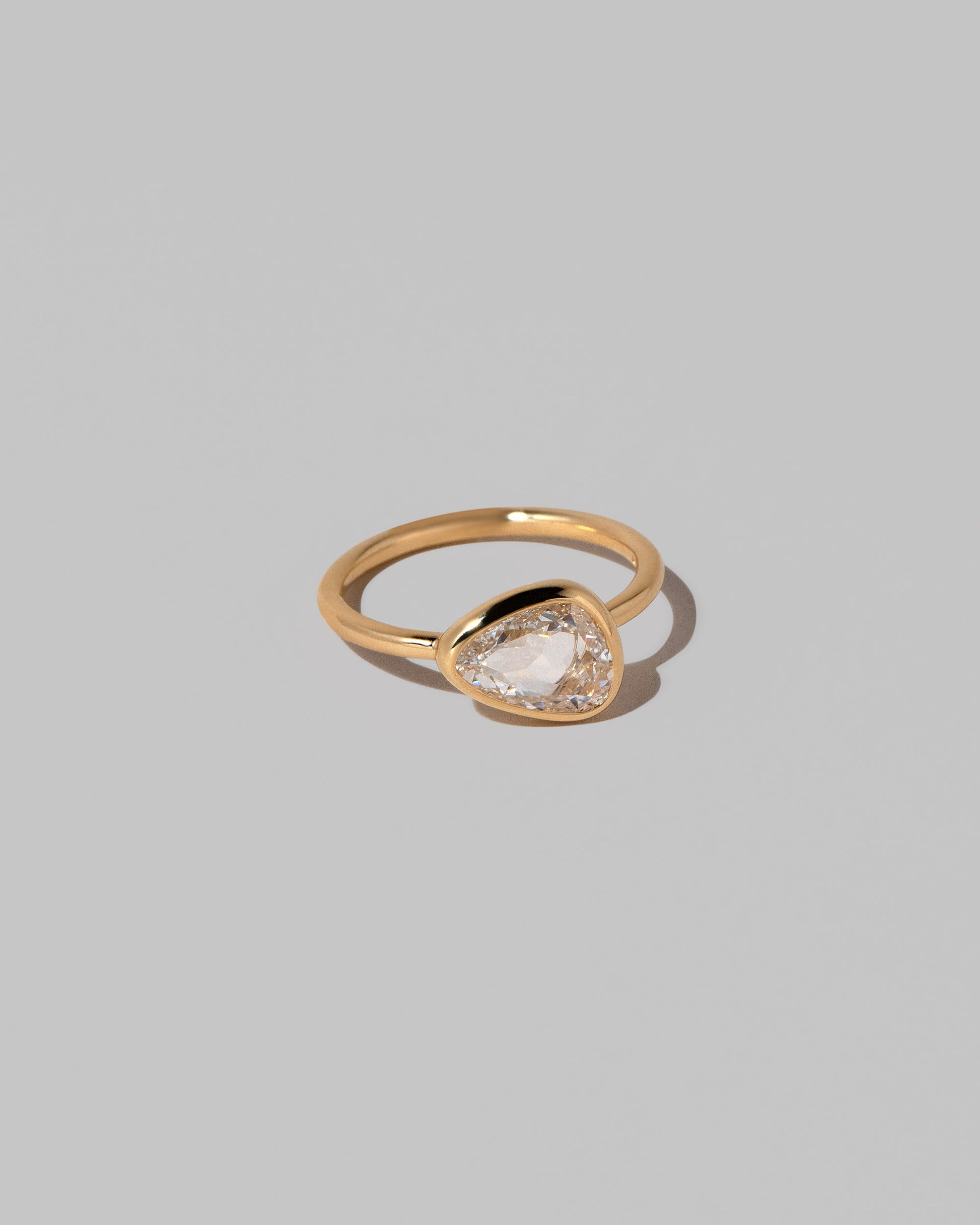 View from the side of the Gusher Diamond Ring 042 on light color background.