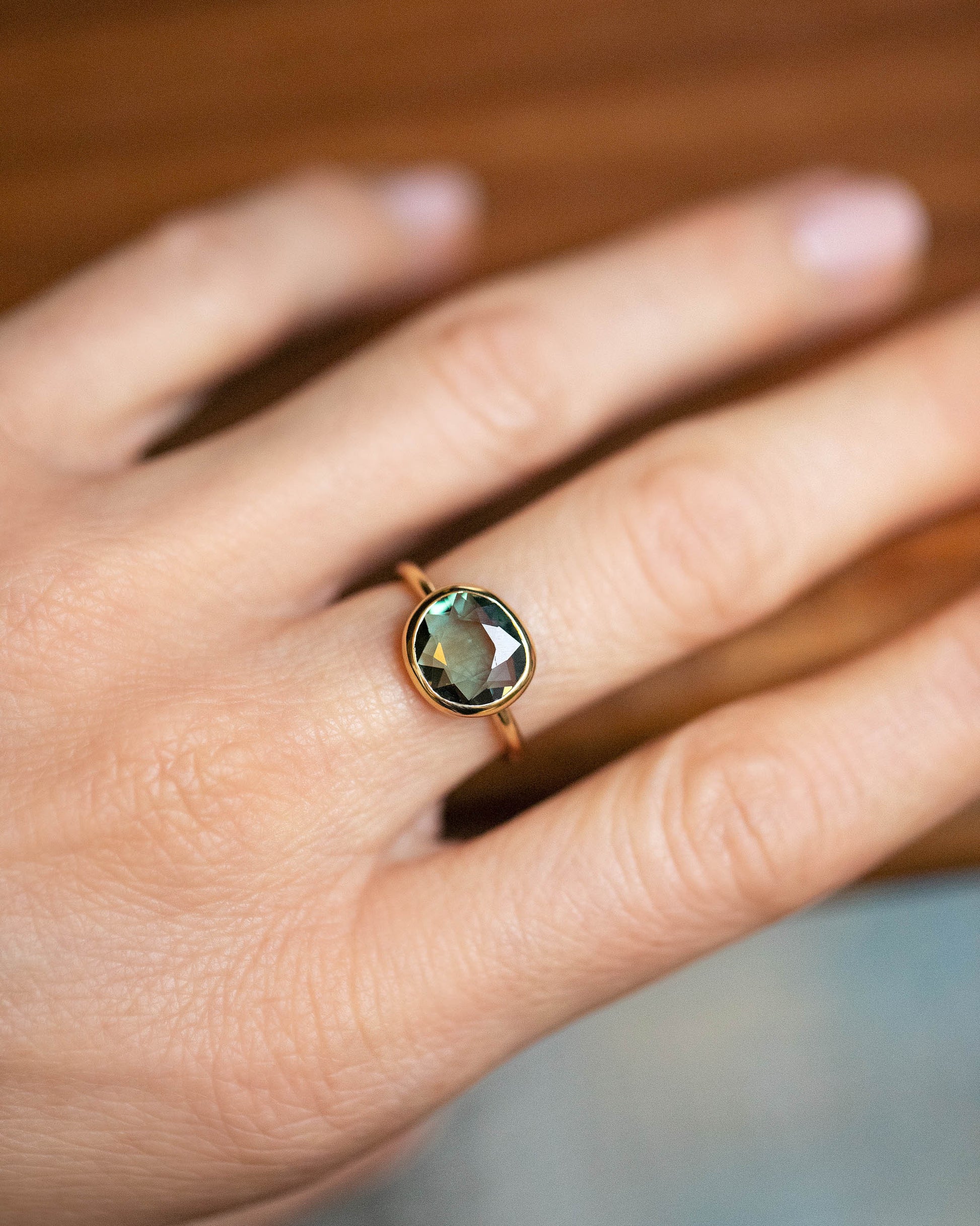 Gusher Green Sapphire Ring 032 on model.