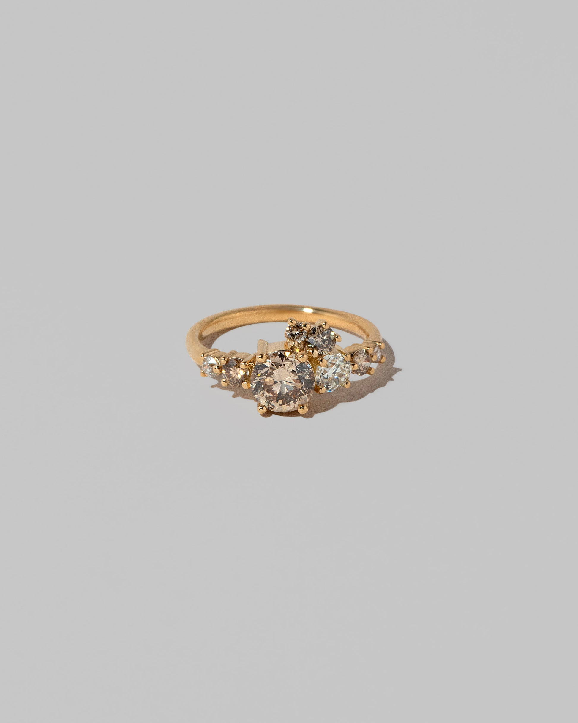 Champagne Diamond Luna Ring on light color background.