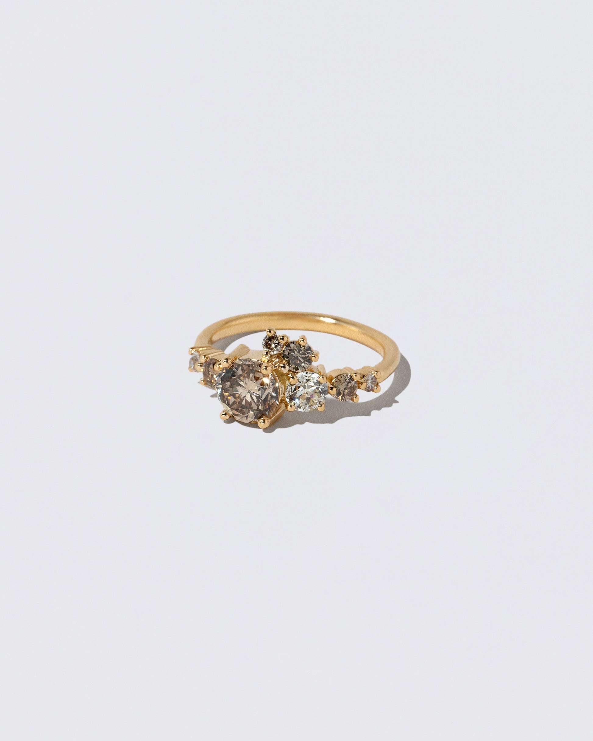 View from the side of the Champagne Diamond Luna Ring on light color background.