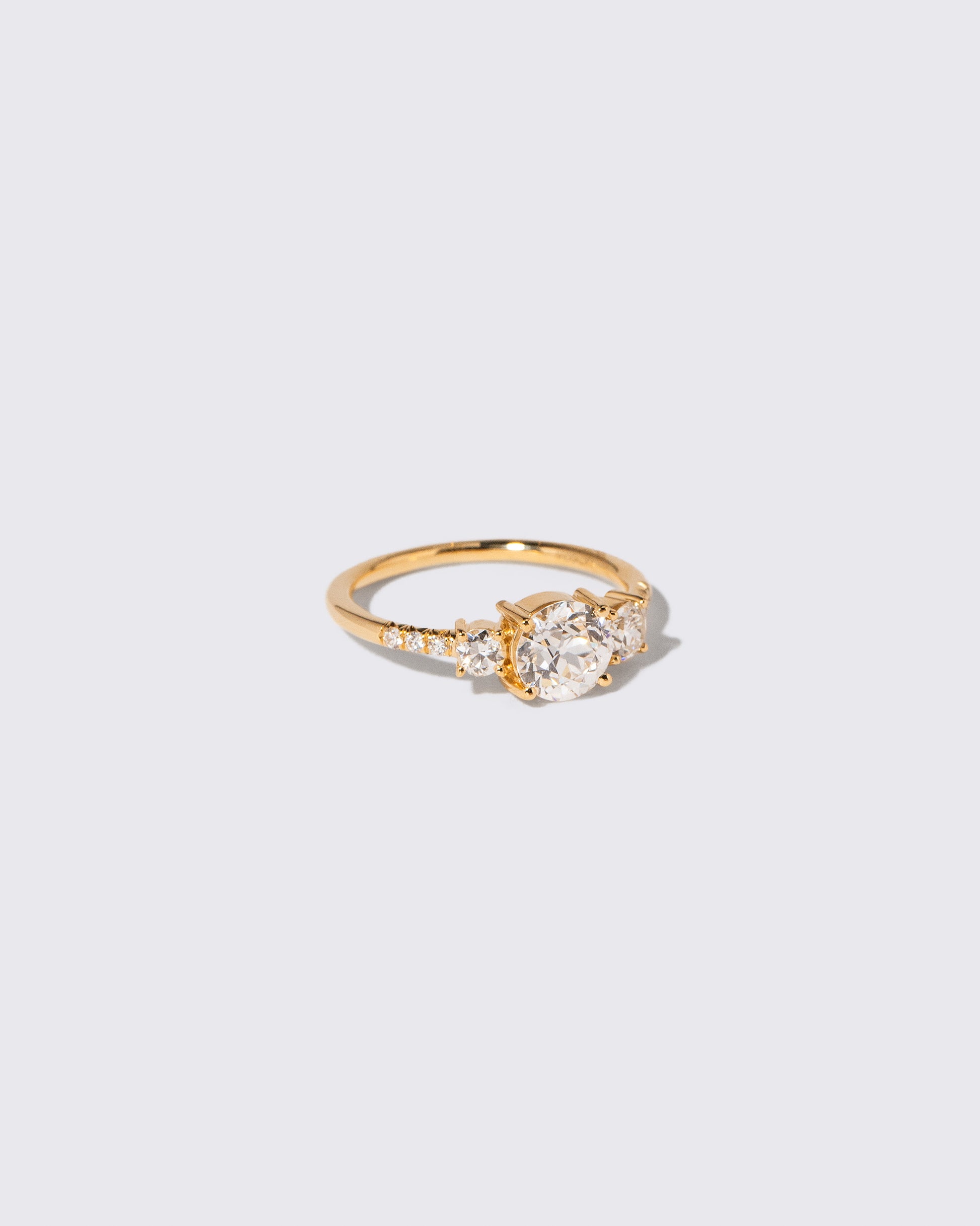View from the side of the White Diamond Orion Ring on light color background.