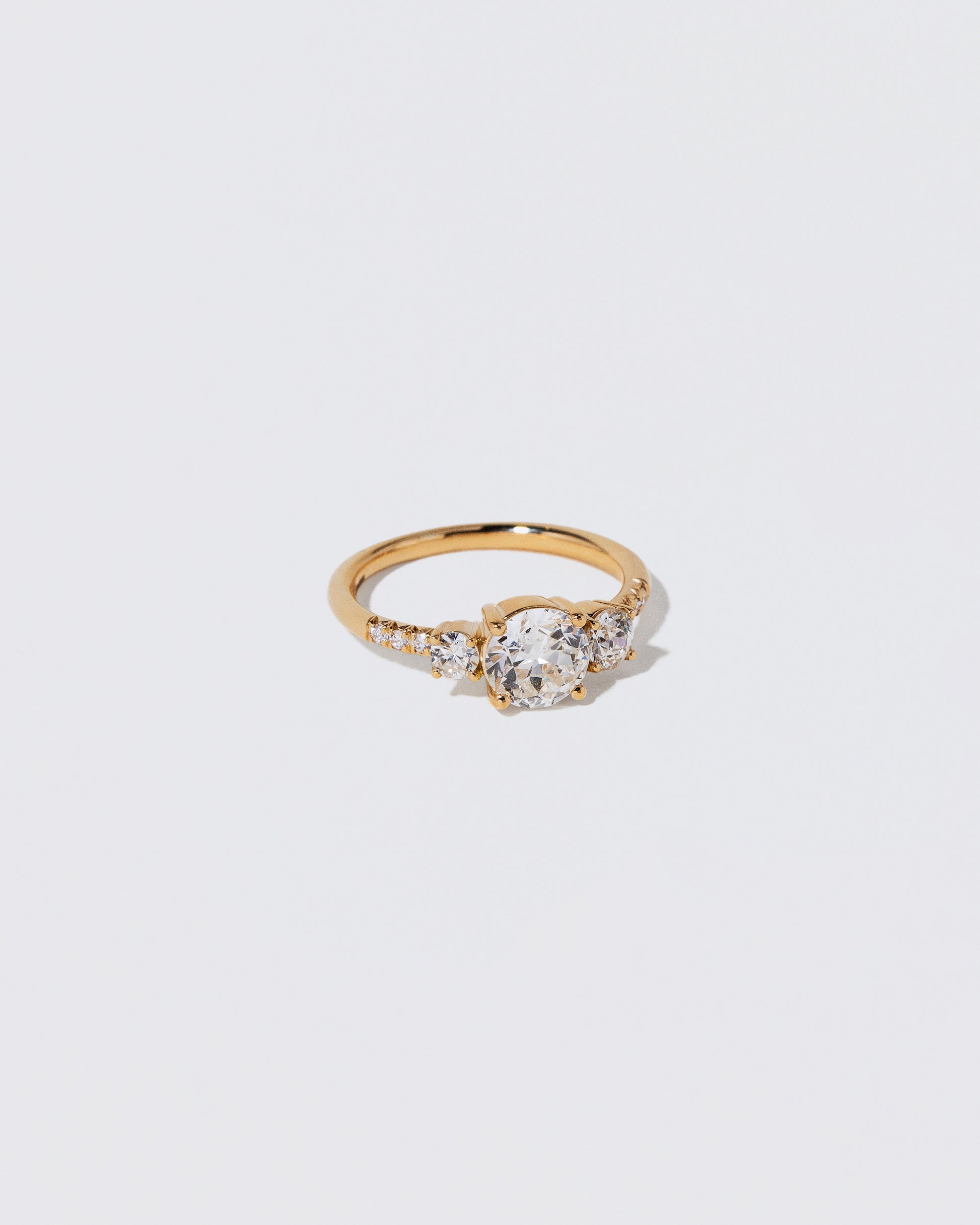 View from the side of the White Diamond Orion Ring on light color background.