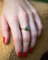 Oval Emerald Equalize Ring on model.