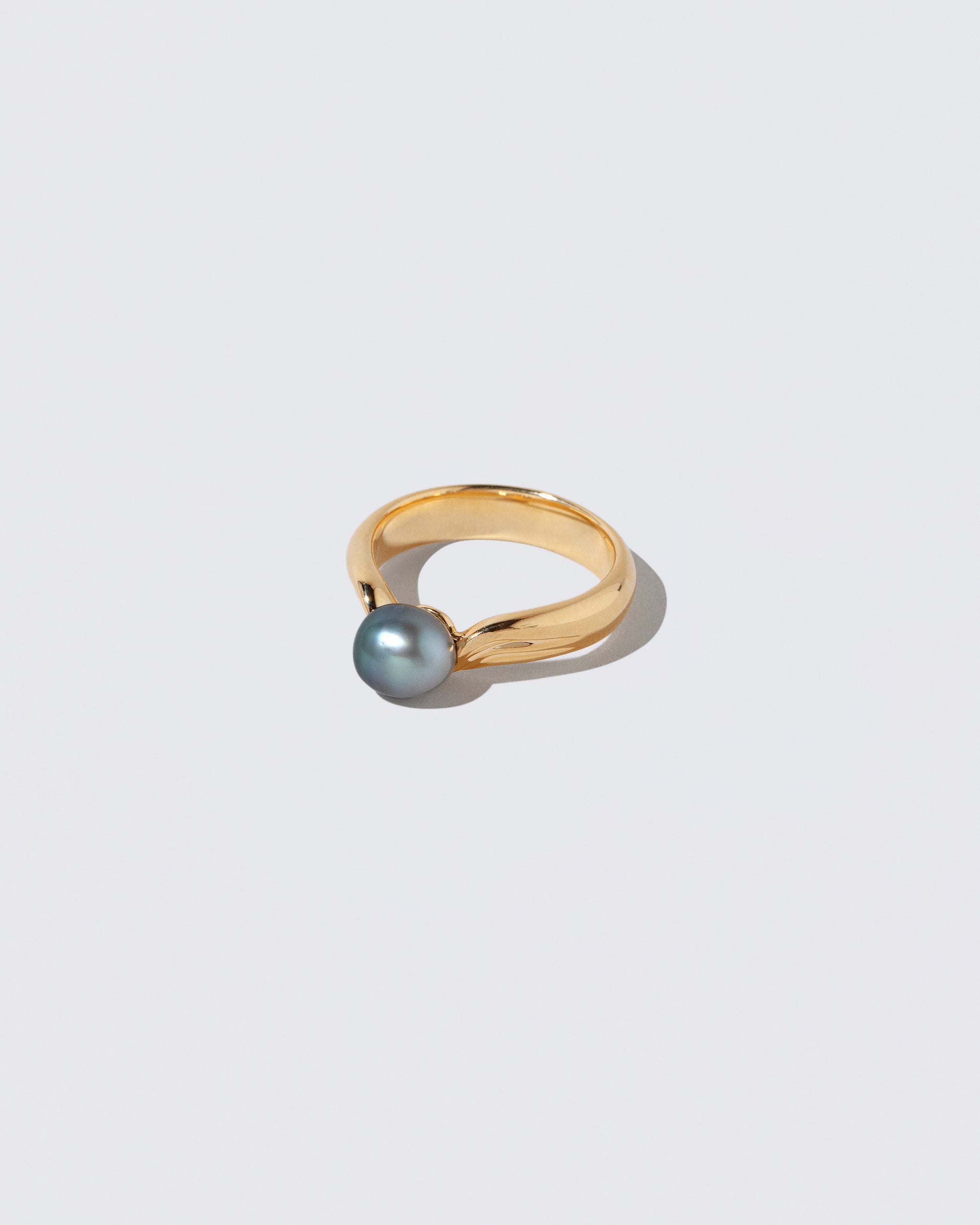 View from the side of the Scylla Ring on light color background.