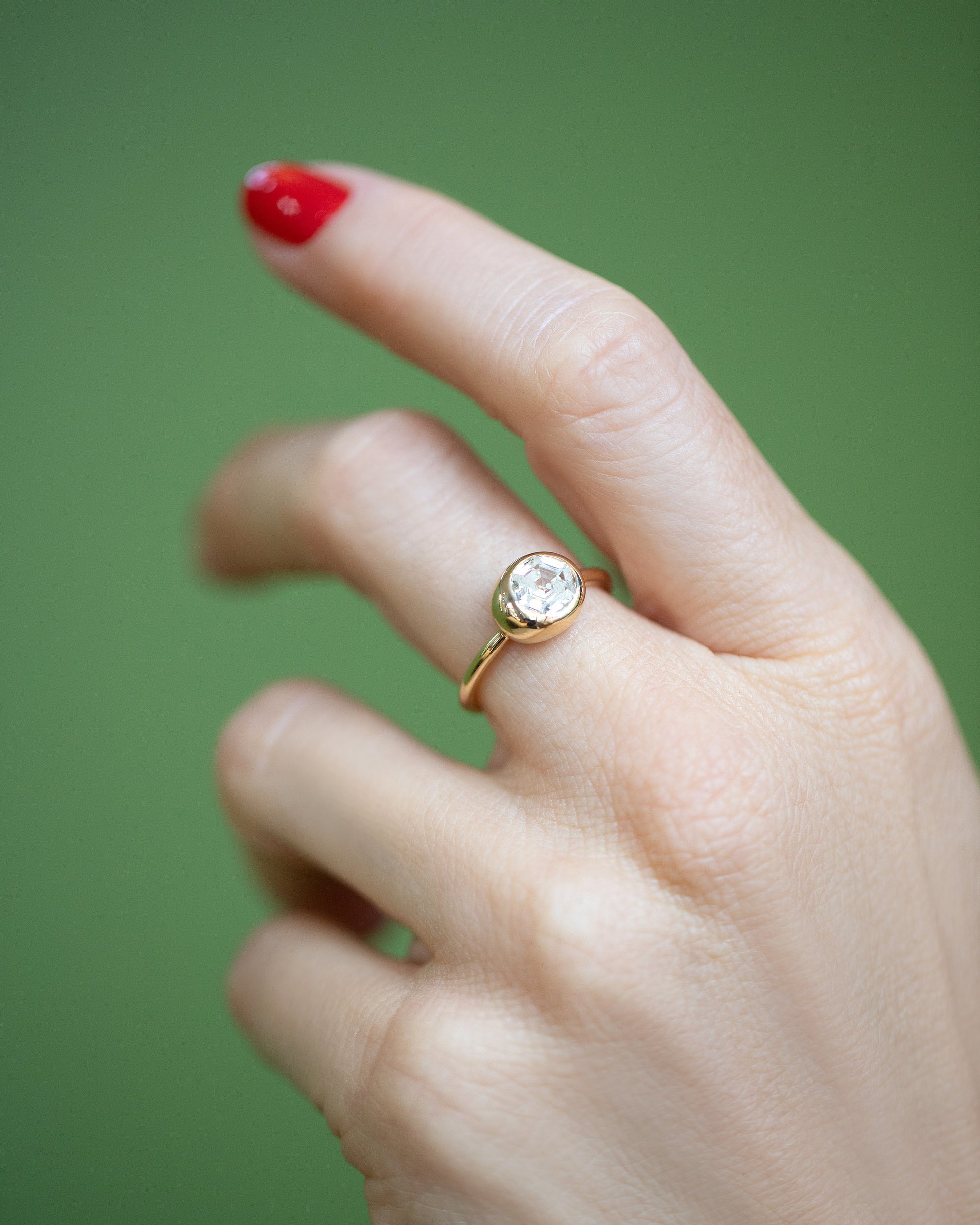 Step Cut Diamond Grand Level Ring on model.