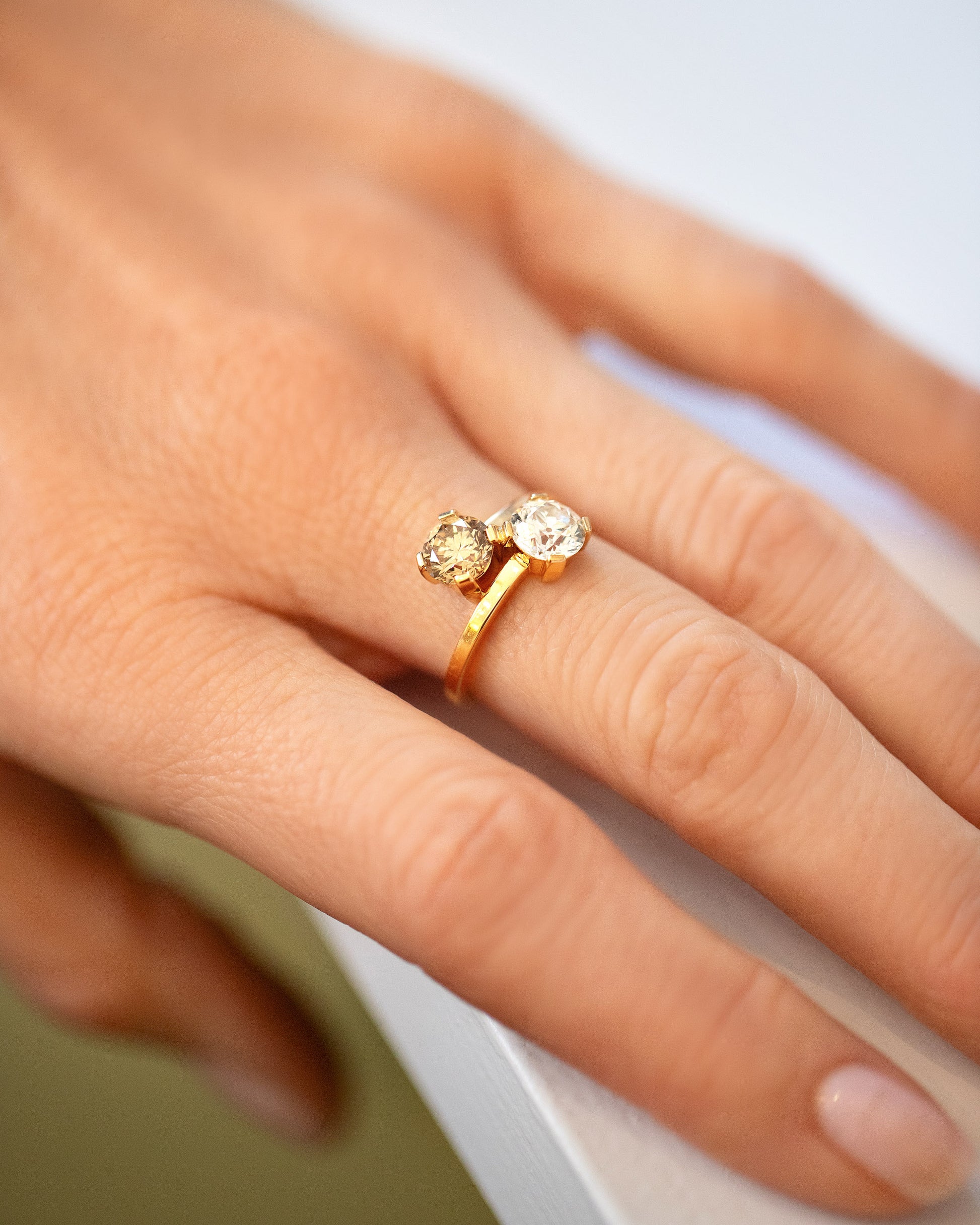 A past version of the Champagne & White Diamond Union Ring on model.