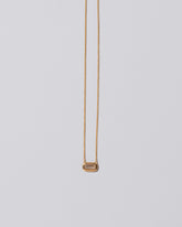 Shah Necklace on light color background.