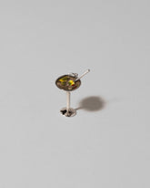 Dirty Martini Charm on light color background.