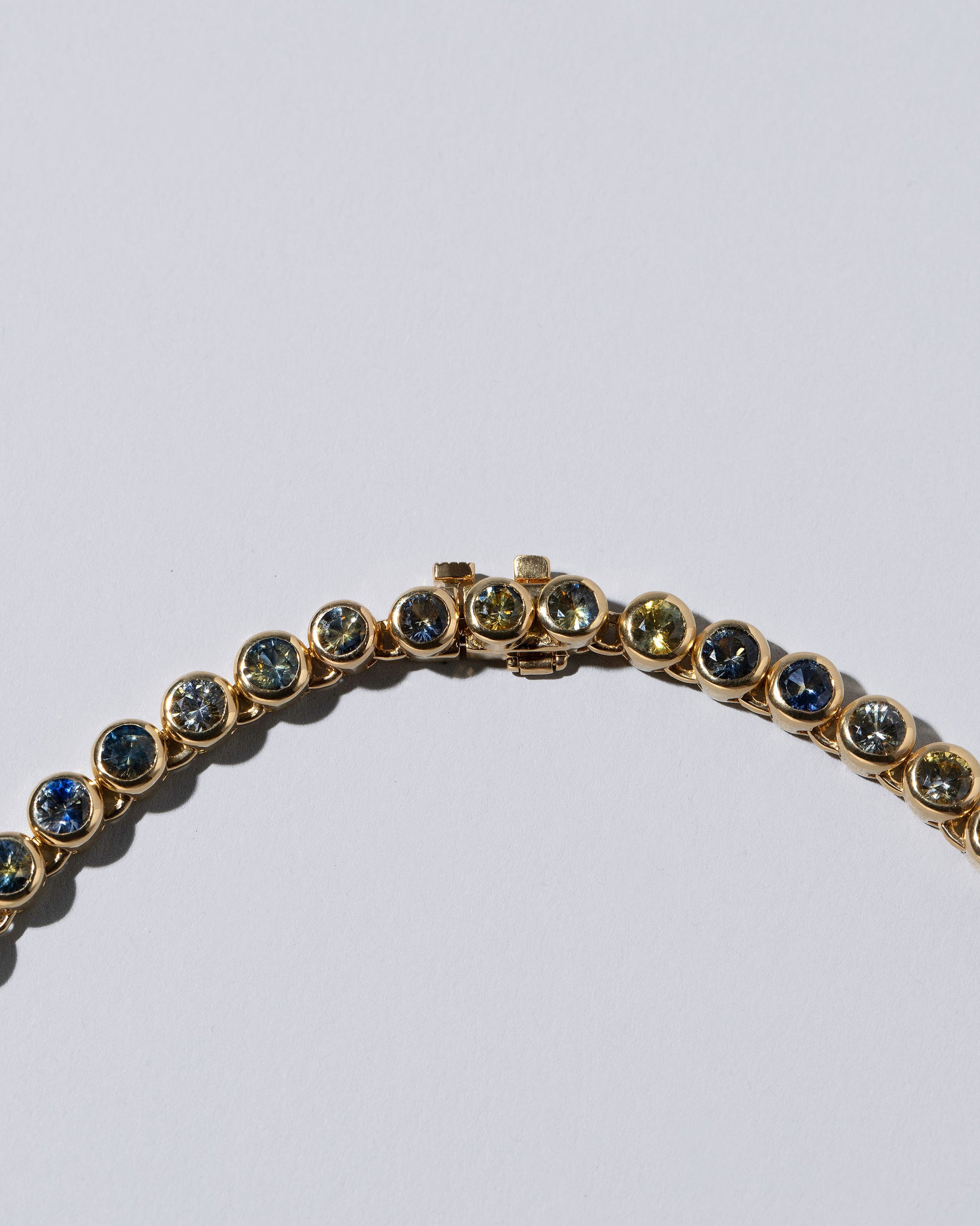 Closeup details of the Hologram Necklace on light color background.