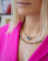 Reverence Necklace and Hologram Necklace on model.