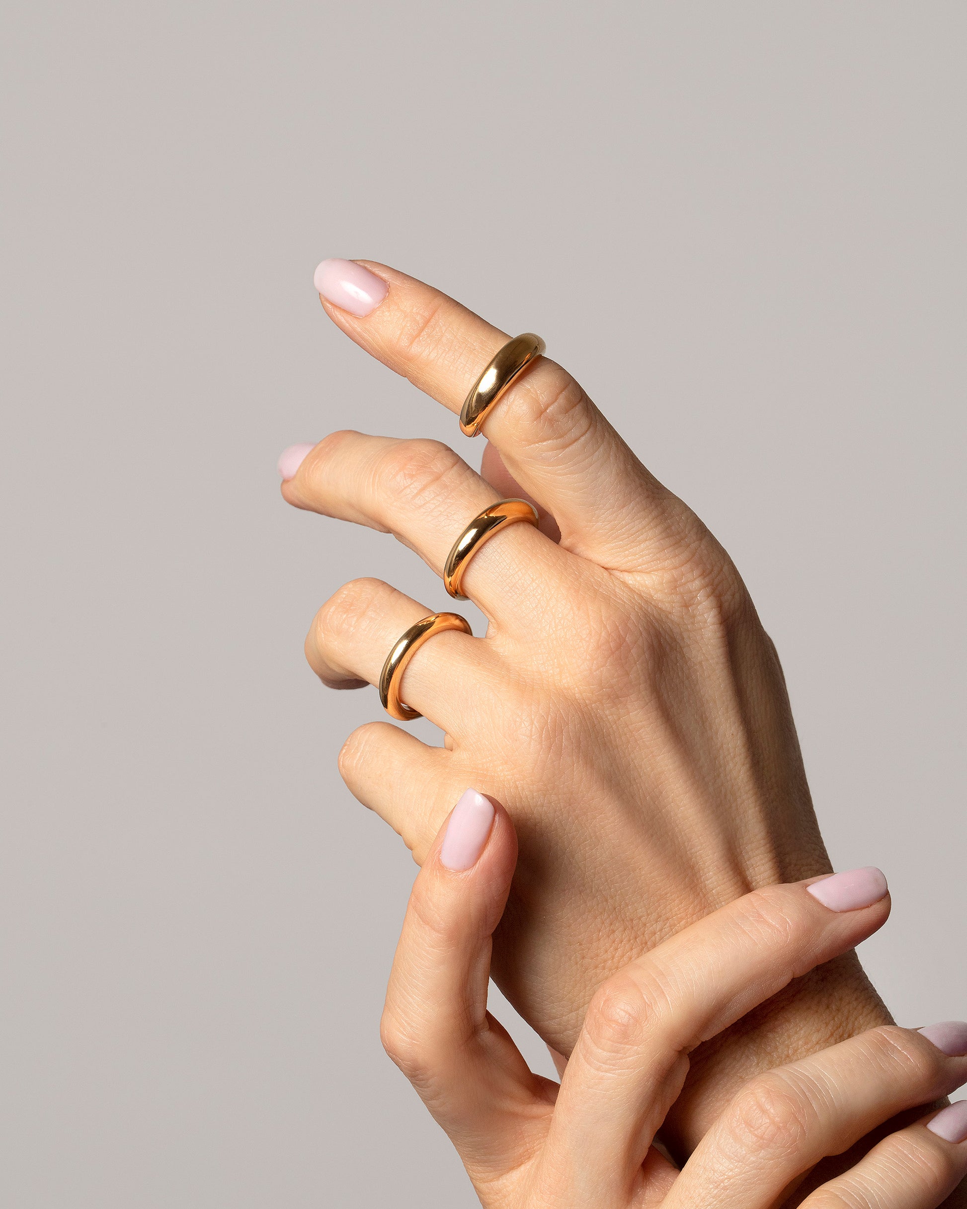 2.5mm,  4.5mm and 5.5mm Gold Venus Bands on model.