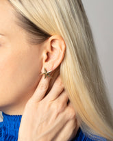 Gold Large Verve Five Point Stud Earrings on model.