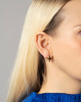 Large Verve Six Point Star Stud Earrings on model.
