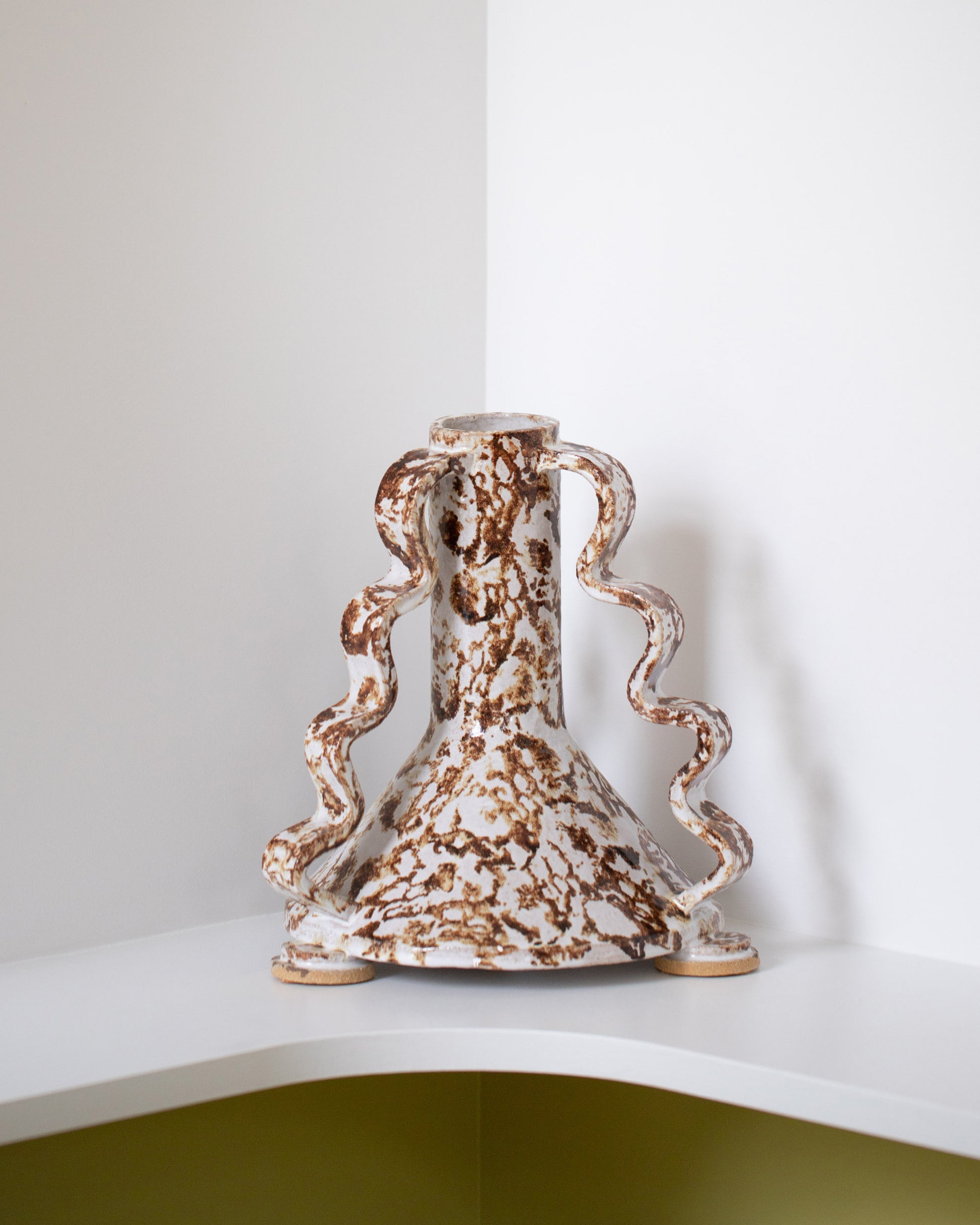 Morgan Peck Brown and White Swoop Vase on light color background.