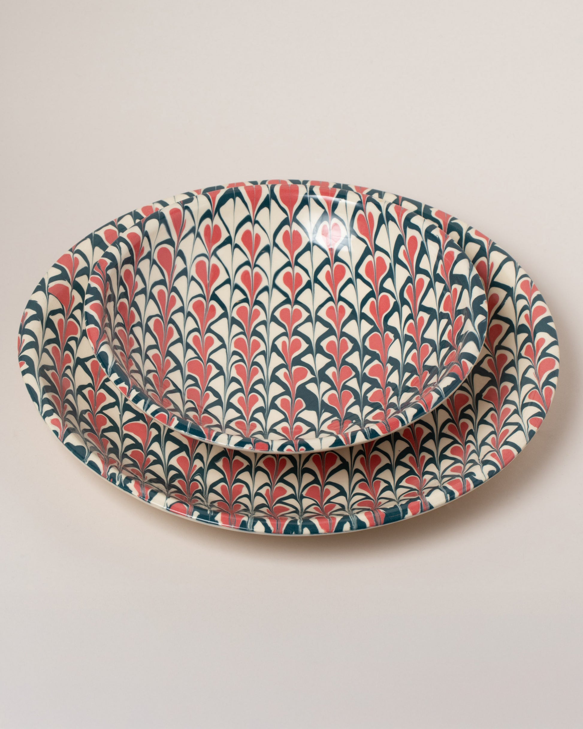 Closeup details of the Morgan Levine Spade Pasta Bowl and Morgan Levine Spade Platter on light color background.