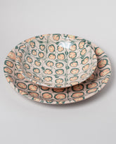 Closeup details of the Morgan Levine Pastel Pasta Bowl and Morgan Levine Pastel Platter on light color background.