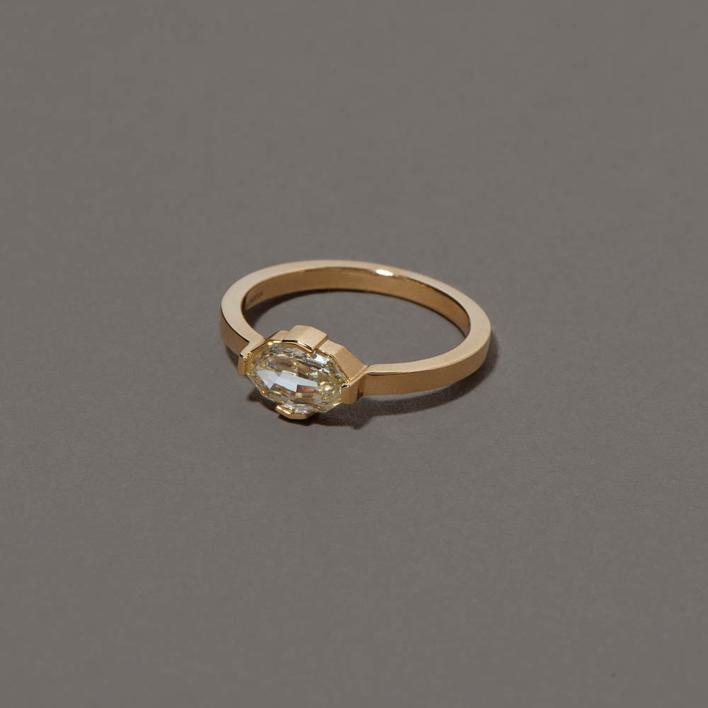 product_details::Closeup details of the Beholden Ring on grey color background.