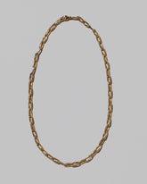 Wavy Link Chain Necklace on light color background.