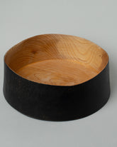 Inside view of the Namu Home Goods Medium Zelkova Wood Black Lacquered Vessel on light color background.