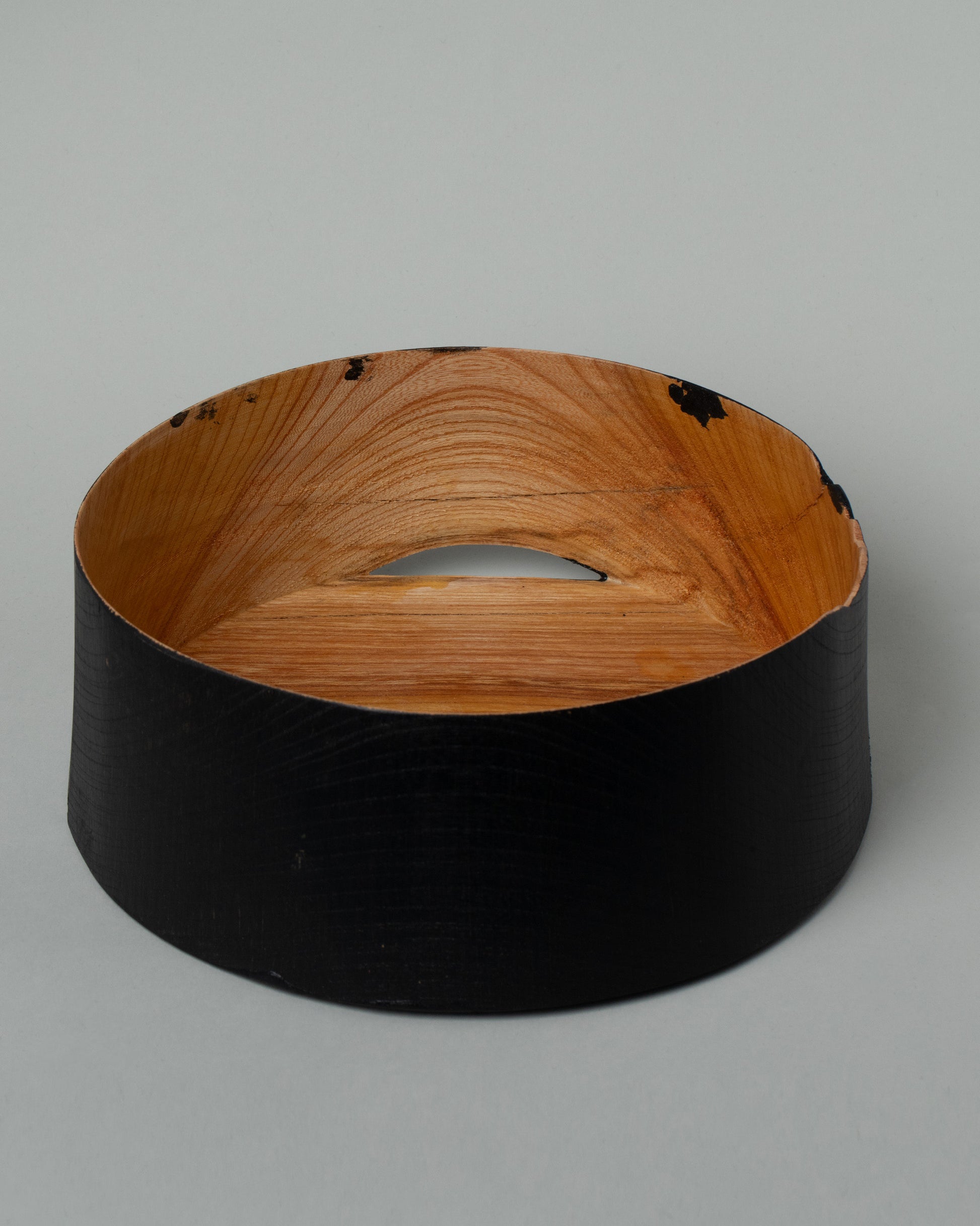 Inside view of the Namu Home Goods Medium Zelkova Wood Black Lacquered Vessel on light color background.