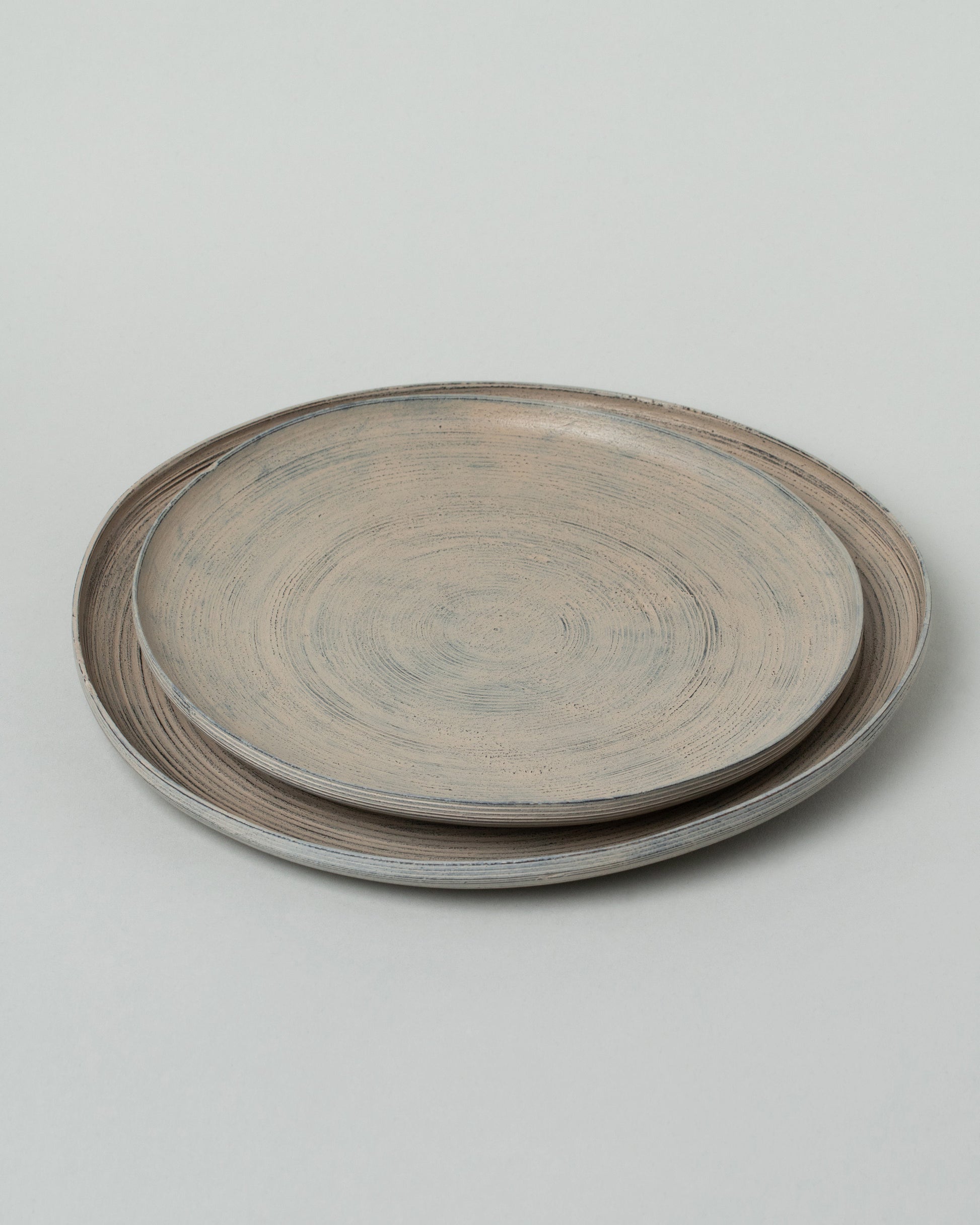 Namu Home Goods Large Zelkova Wood Winter Organic Plate and Namu Home Goods Small Zelkova Wood Winter Organic Plate on light color background.
