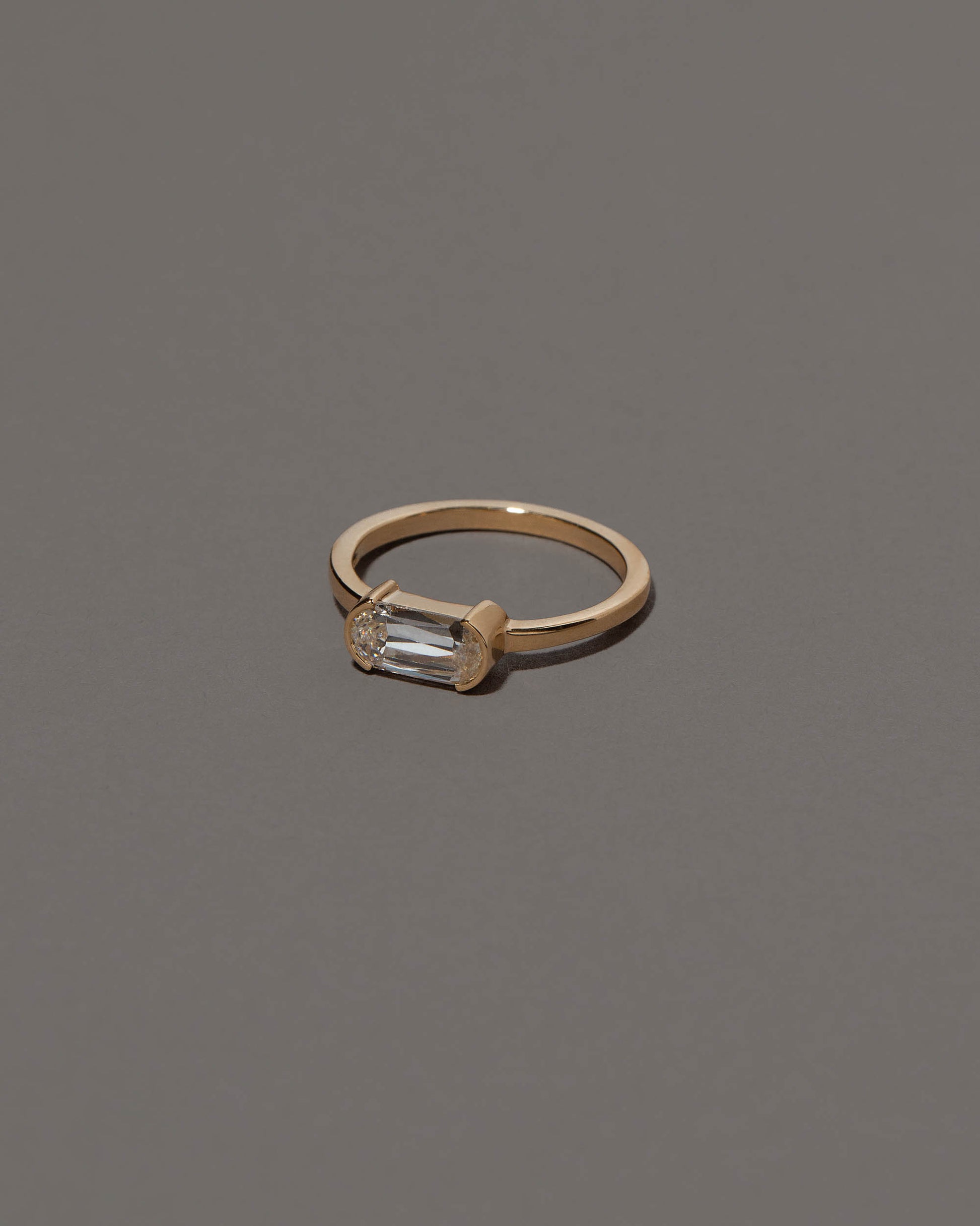View from the side of the Conviviality Ring on grey color background.