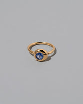 Past version of the Blue Sapphire Level Ring on light color background.