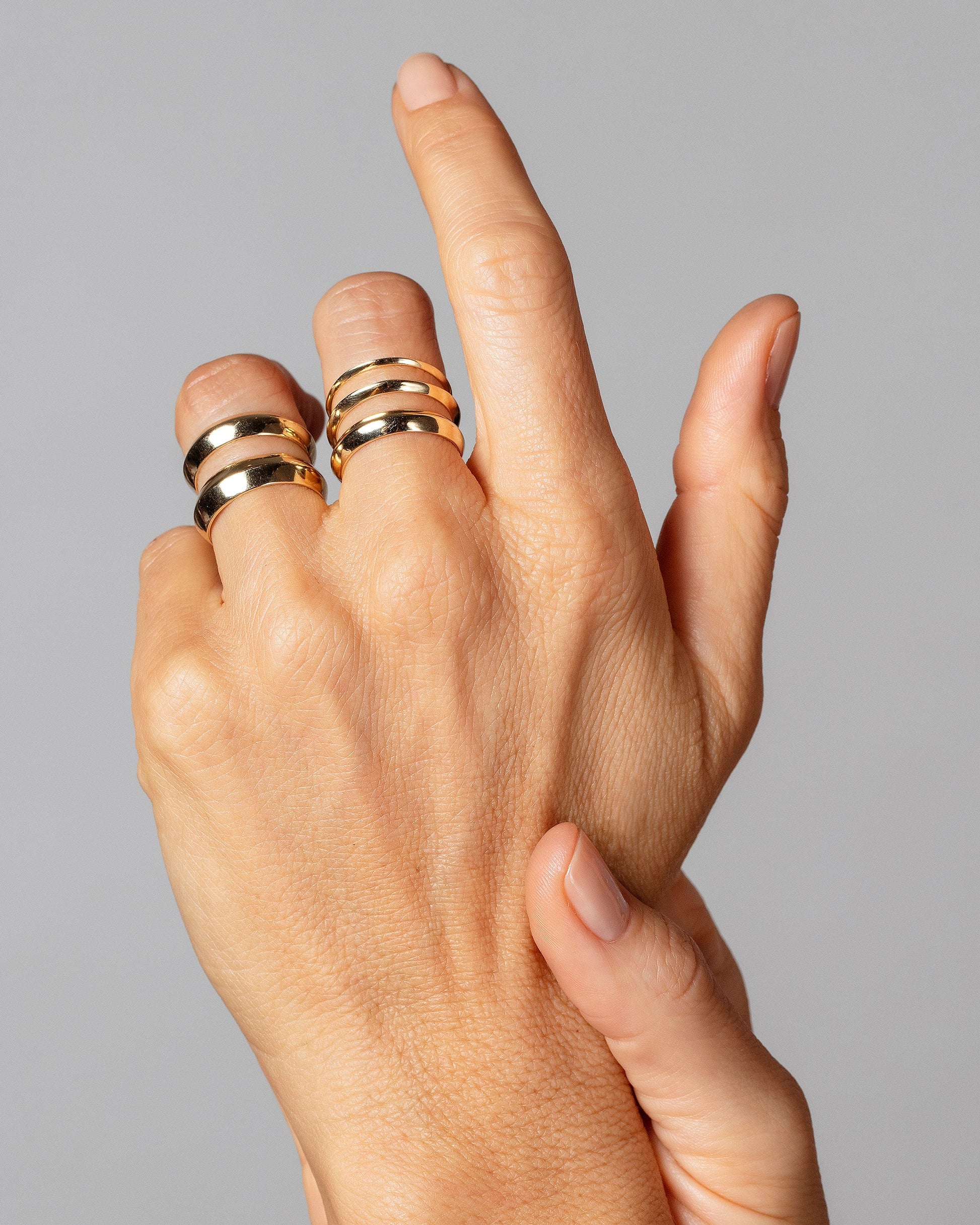 Gold Knife Edge Bands on model.