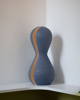 Pat Kim Blue Slice on light color background.