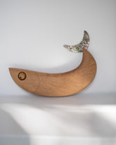 Pat Kim For Your Pleasure Mulgogi wall hanging on light color background.