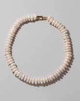 Button Pearl Choker Necklace on light color background.