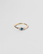 Persephone Ring on light color background.