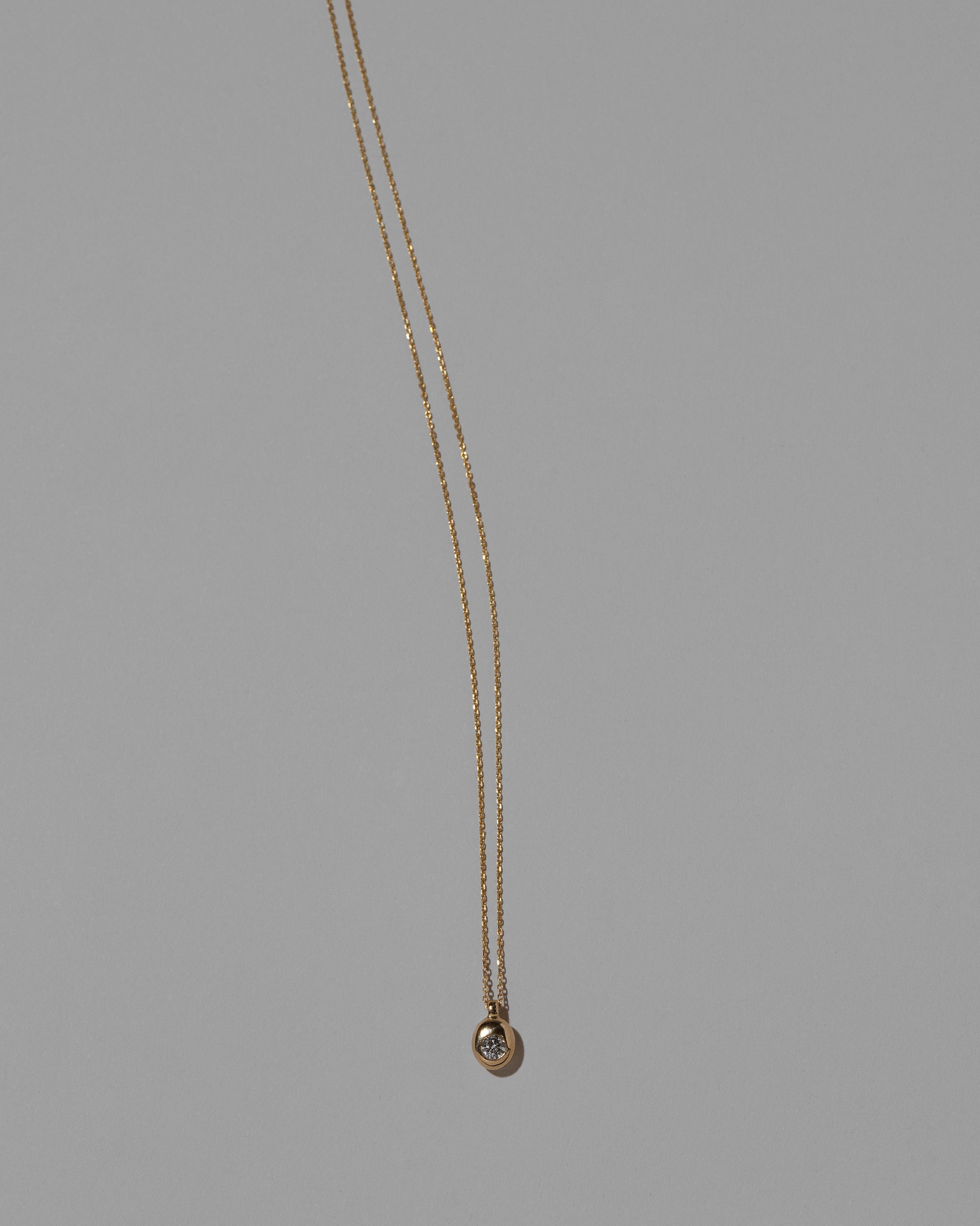 Diamond Birthstone Level Necklace on light color background.