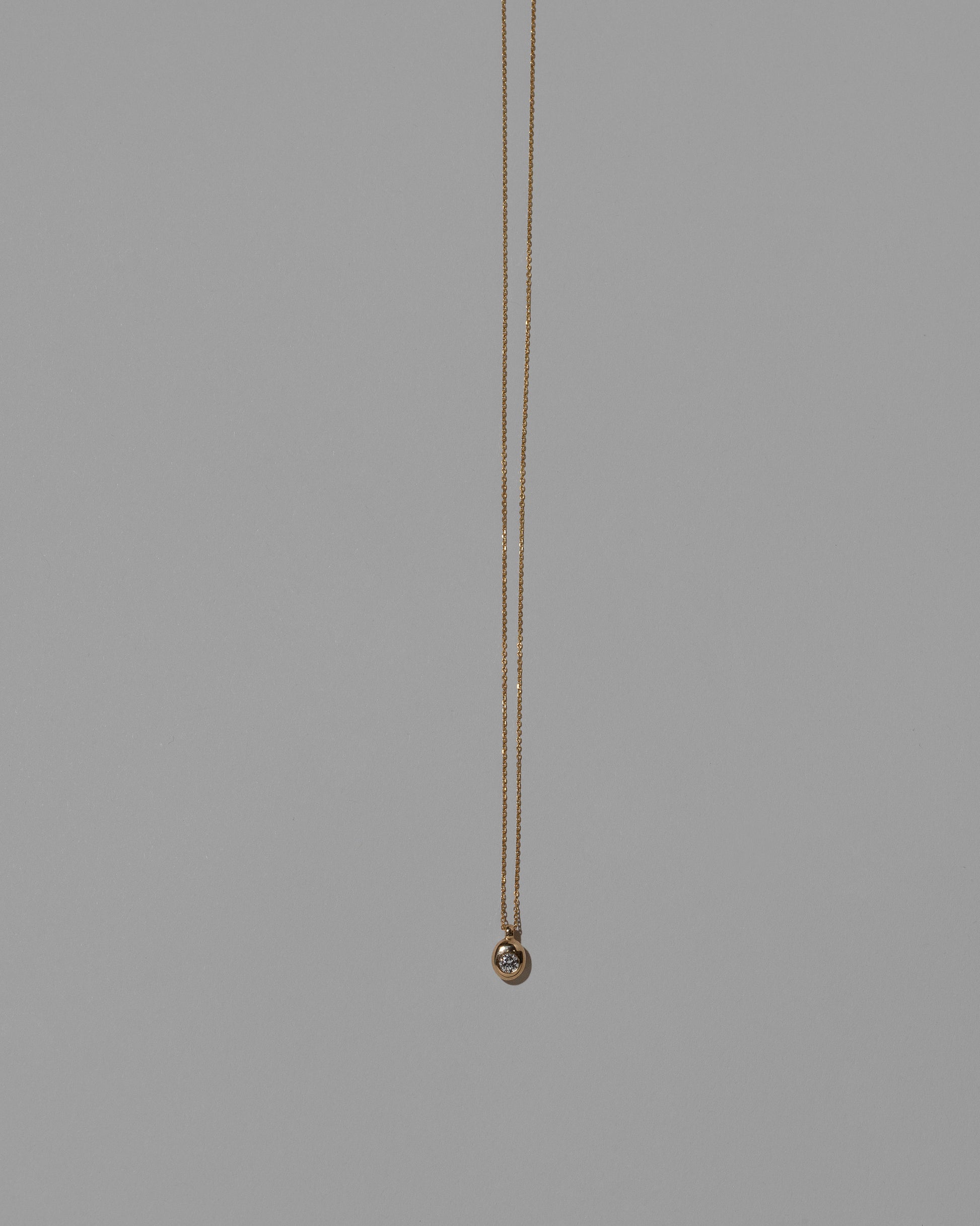 Diamond Birthstone Level Necklace on light color background.