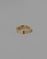 Gold Australian Bicolor Sapphire North South 5mm Baguette-Set Piet Band on light color background.