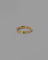 Gold Emerald North South 4mm Baguette-Set Piet Band on light color background.