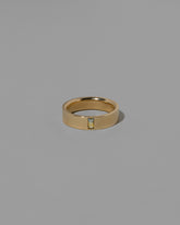 Gold Montana Bicolor Sapphire North South 5mm Baguette-Set Piet Band on light color background.